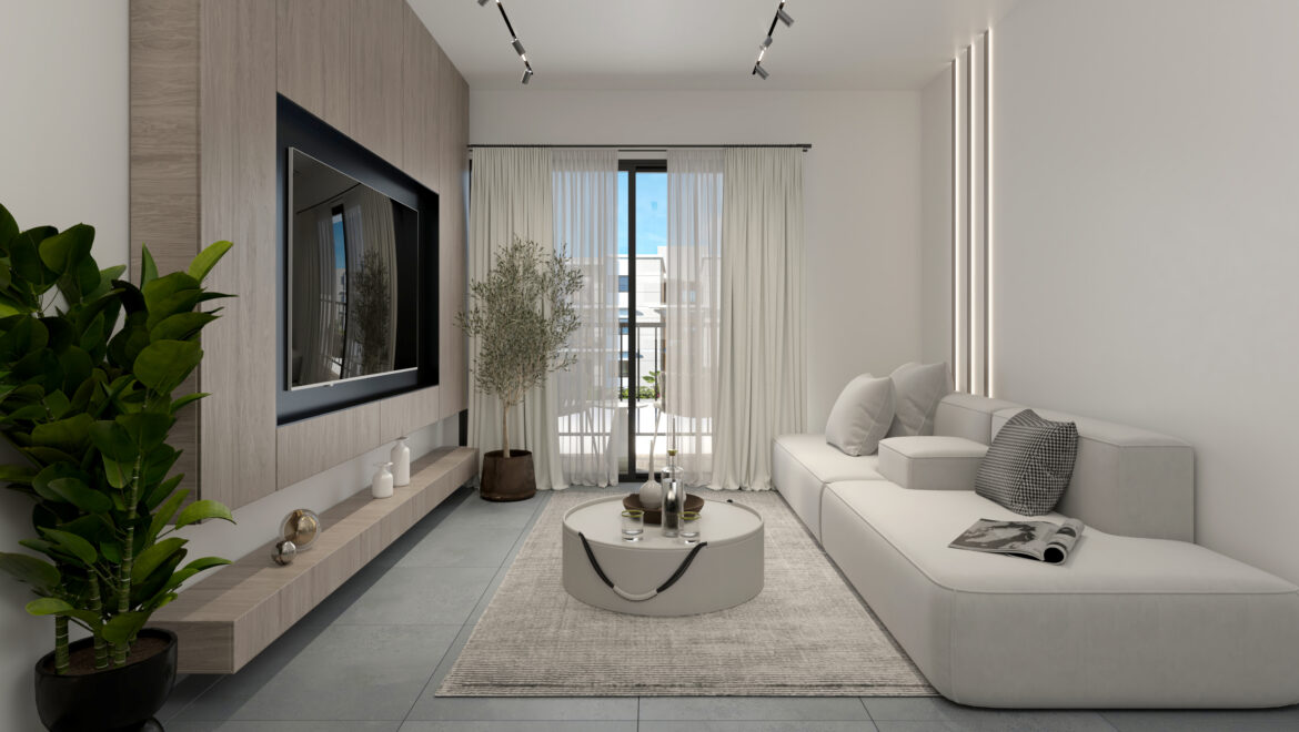 Modern living room with a wall-mounted TV, light wood paneling, and a white sectional sofa by large windows with sheer curtains.