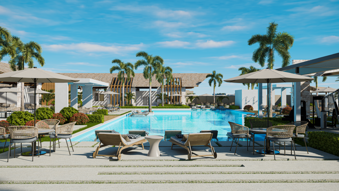 Resort poolside area with lounge chairs, beige umbrellas, and palm trees under a blue sky.