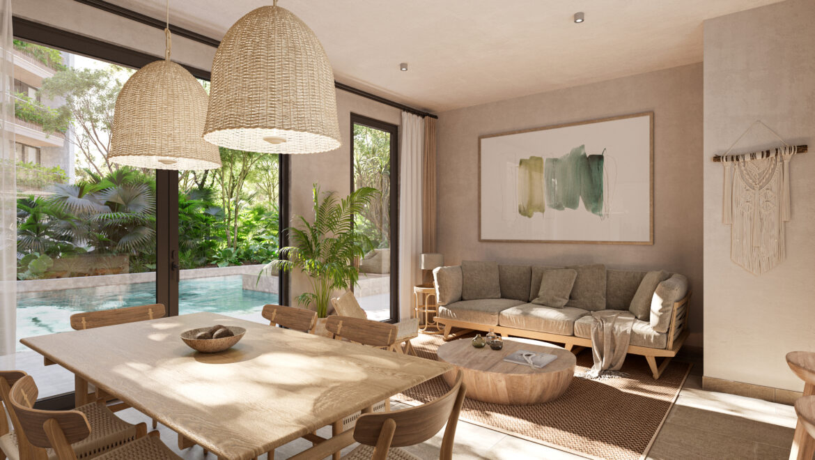 Open-plan living and dining room with large woven pendant lights, wooden table and beige sofa, overlooking a lush garden through glass doors.