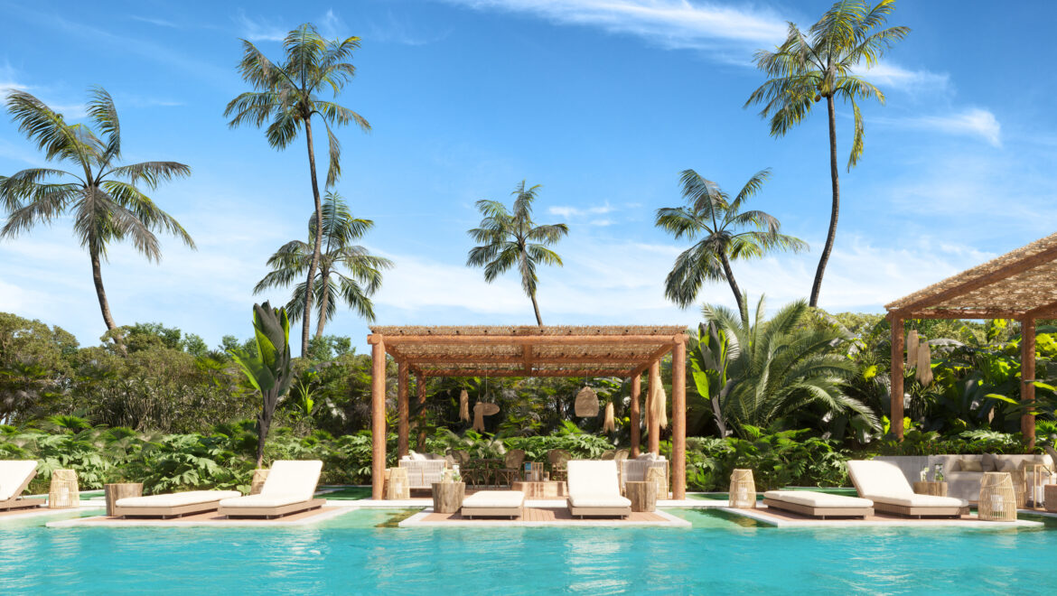 Poolside scene with white lounge chairs beneath a thatched pergola, surrounded by palm trees and tropical plants.
