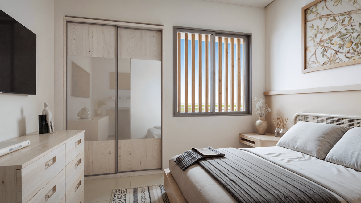 Bright modern bedroom with a low wooden bed, gray pillows, and a woven headboard; a light wood dresser and a wall-mounted TV on the left; plants nearby and a sliding wardrobe with frosted panels in the center; striped rug on the floor and a window with wooden slats on the right.