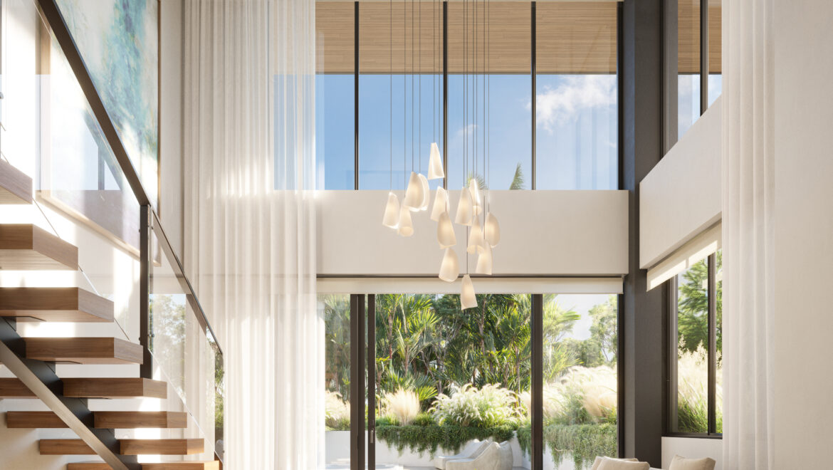Open living room with floor-to-ceiling glass walls, beige sofa, blue chair, and a floating wooden staircase on the left; bright natural light.