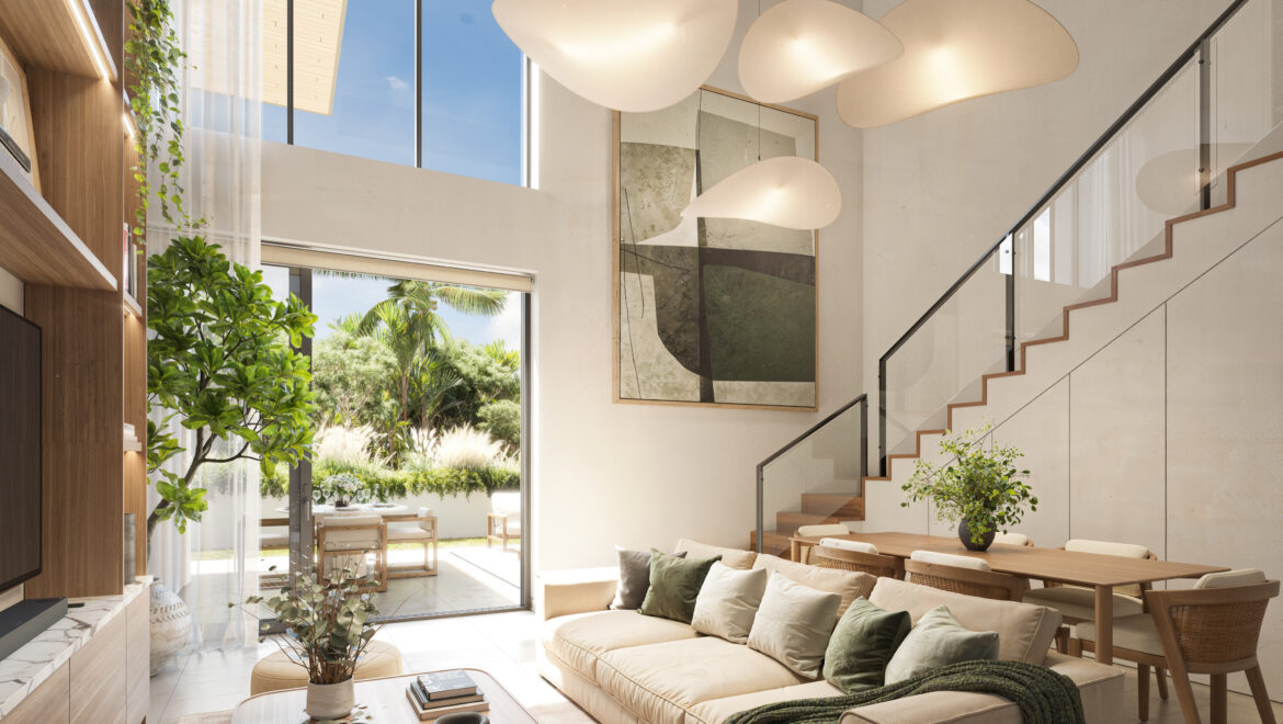 Bright contemporary living room with beige sectional, wooden coffee table, and large windows showing a garden outside.