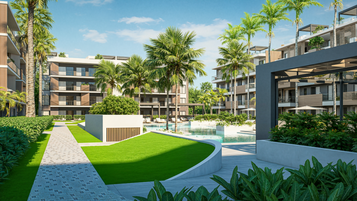 Modern residential complex with a central pool, palm trees, and lounge chairs under clear skies.