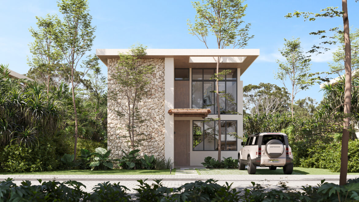 Modern two‑story home with a stone façade, large glass windows, and lush tropical landscaping; a white SUV parked in the driveway beneath a clear sky.