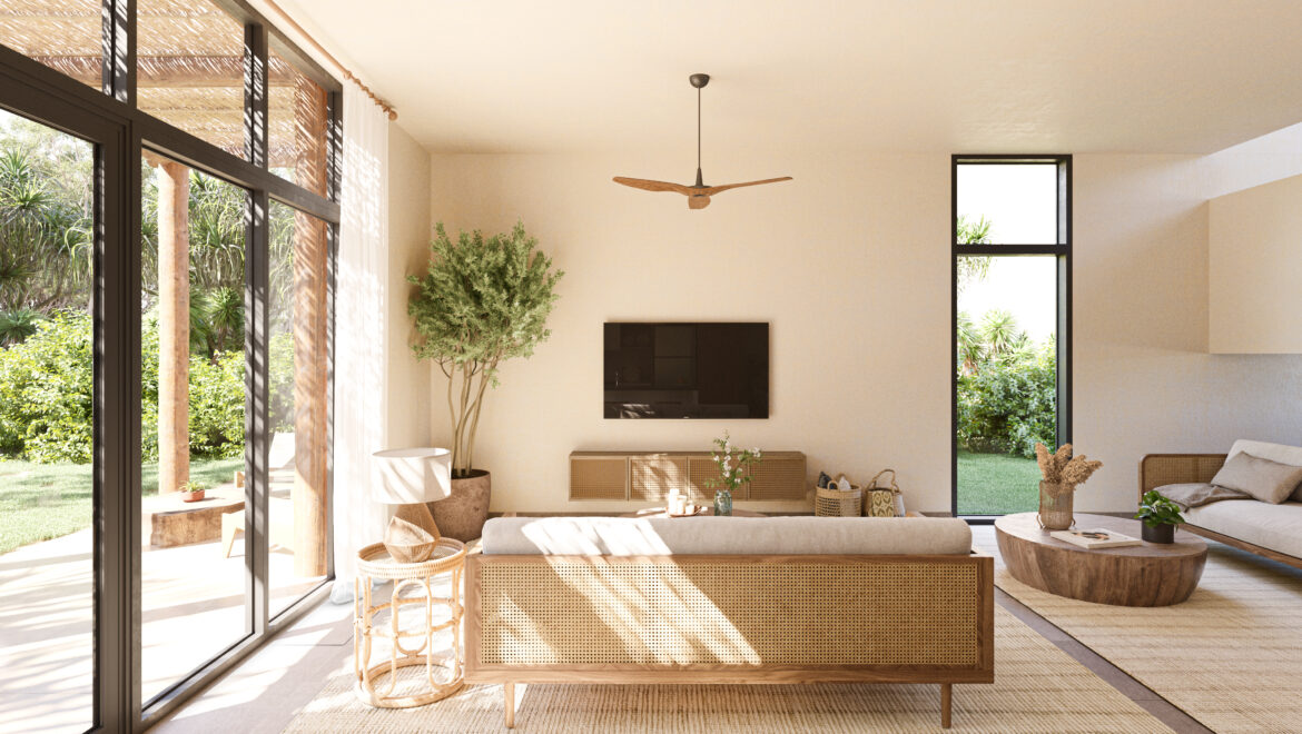 Bright living room with floor-to-ceiling glass doors, wicker furniture, and a central wooden console.