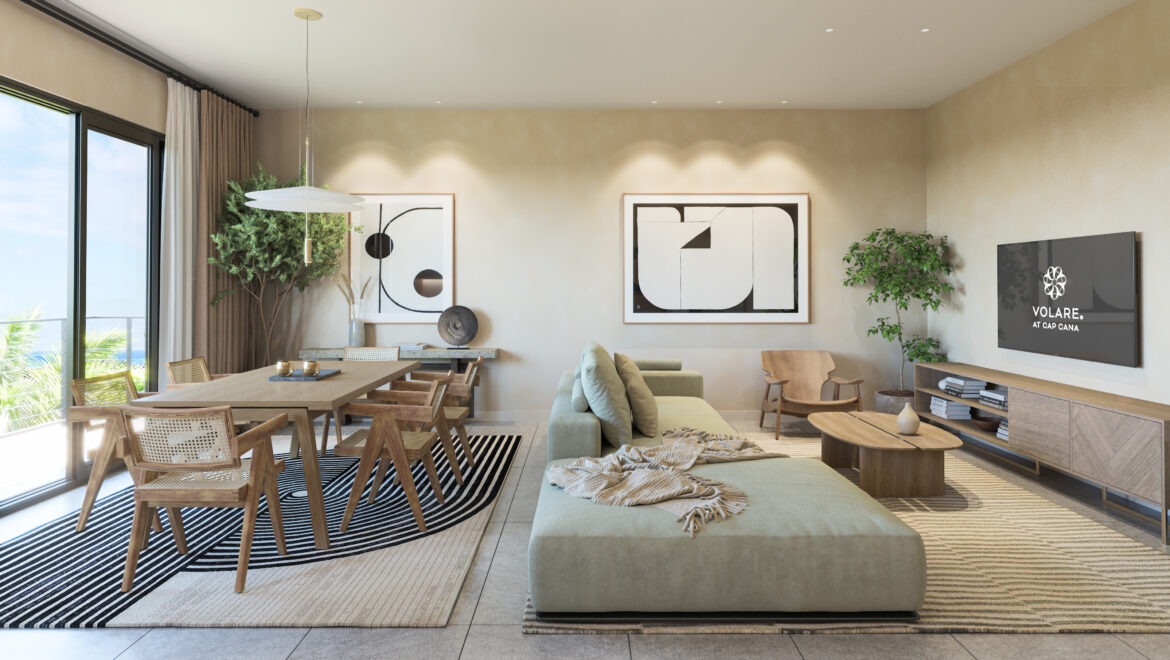 Open-plan living/dining room with a wooden table and eight chairs, beige walls, large abstract art, and a wall-mounted TV displaying Volare logo.