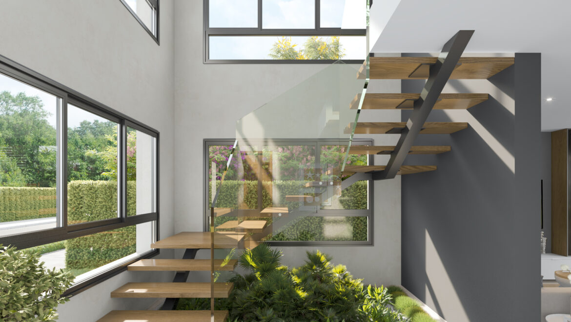 Modern interior staircase with glass railing and floating wooden steps beside large windows with greenery outside.