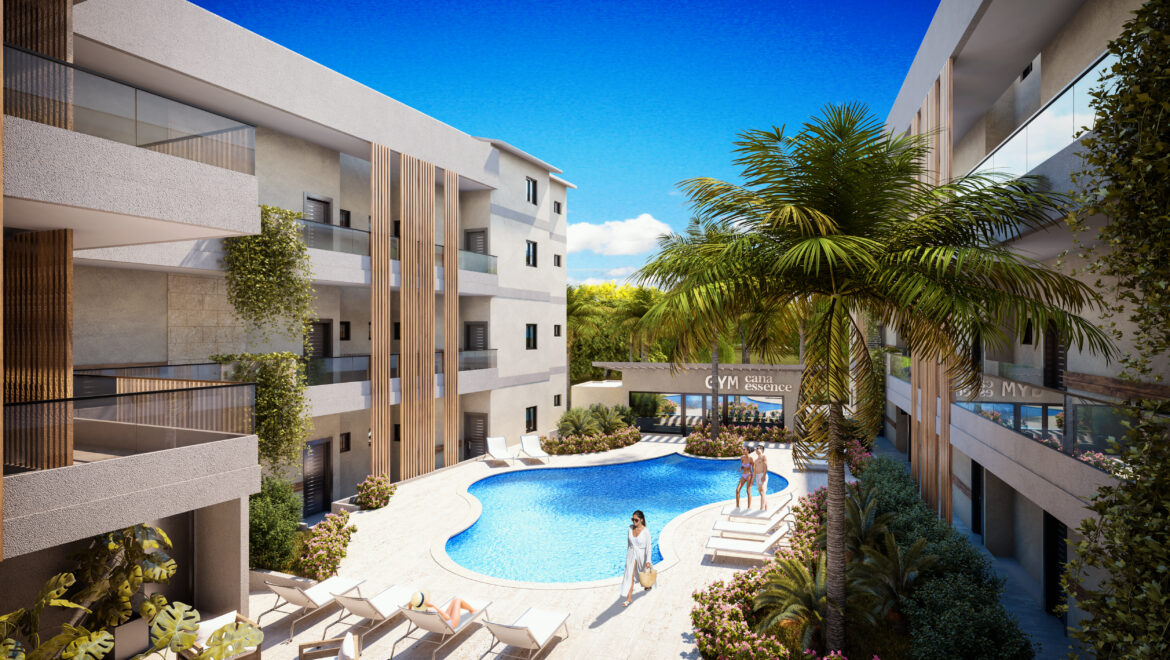 Modern residential courtyard with a kidney-shaped pool, glass balconies, and white buildings.
