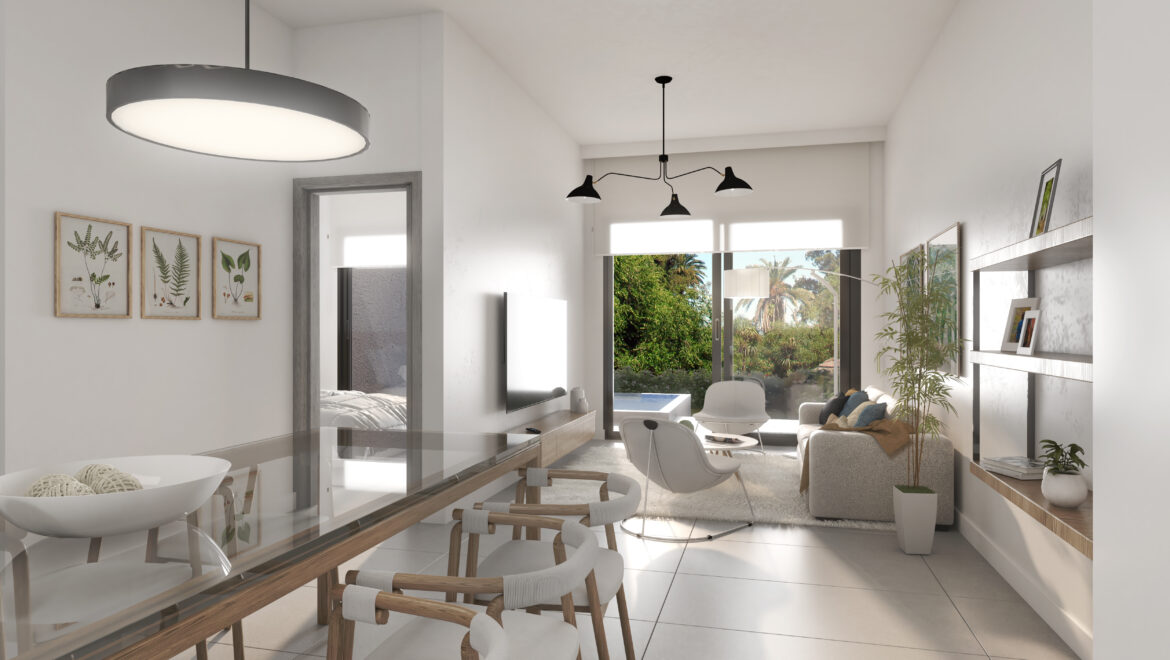 Open-plan dining and living room with a glass dining table, wooden chairs, and a large black pendant light, sunny through the windows.