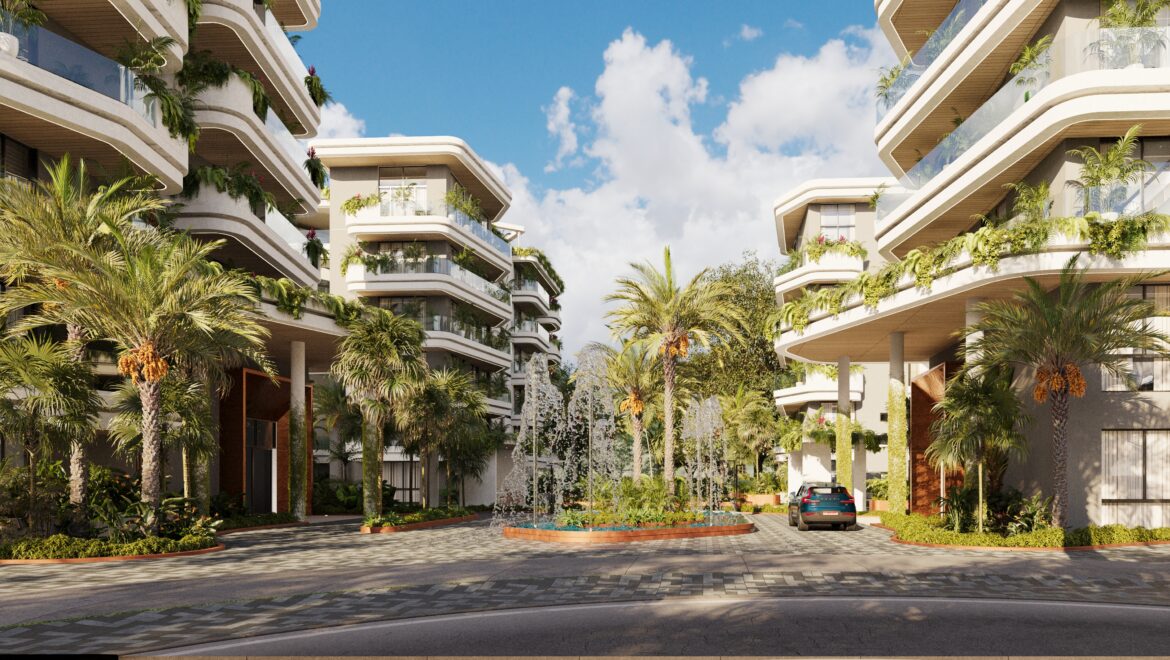 Modern apartment complex with curved balconies, palm trees, and a fountain garden under a blue sky.