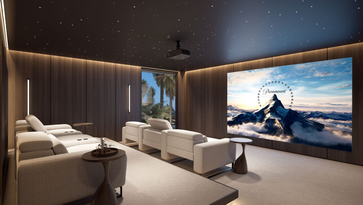 Luxurious home theater with a starry ceiling, wood-paneled walls, two rows of cream recliners, and a projector facing a large screen displaying a mountain image with Paramount logo.