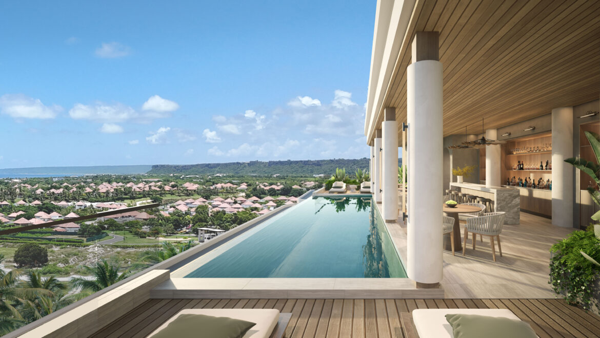 Luxury resort terrace with an infinity pool, open-air bar, and tropical landscape beyond.