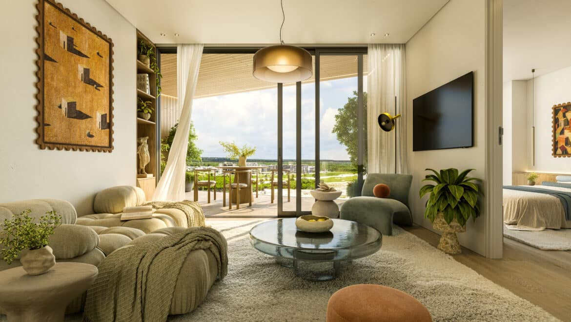 Cozy living room with beige seating, a round pendant lamp, and large glass doors opening to a balcony outdoors.