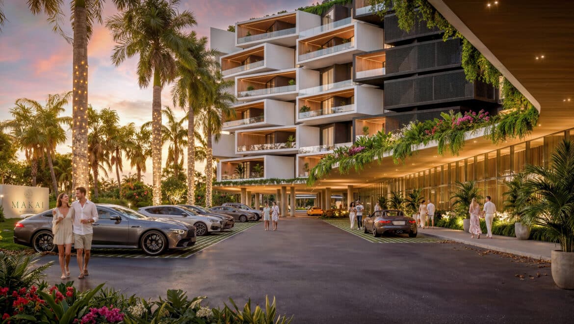 Sunset at Makai Residences: white stacked balconies, palm trees with string lights, parked luxury cars, guests mingling.
