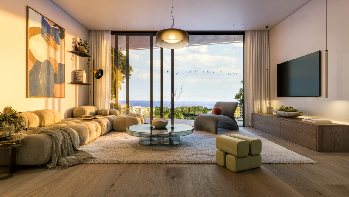 Modern living room with beige sectional sofa, round glass coffee table, wall art, and a large window showcasing an ocean view.