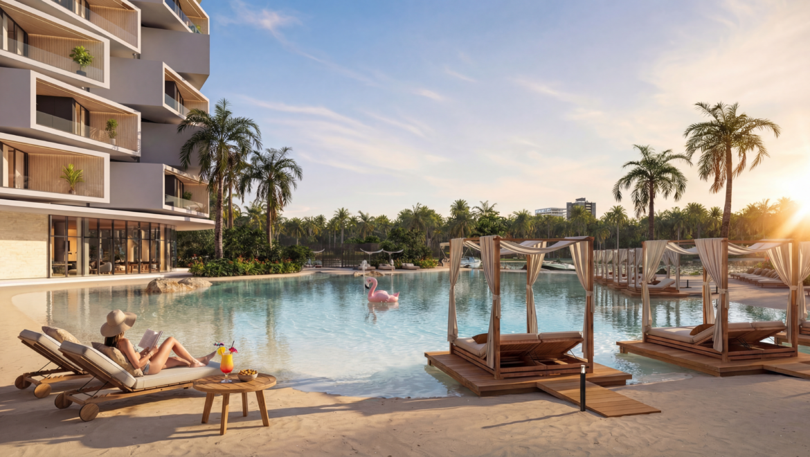 Luxurious resort pool at sunset with a modern building on the left, palm trees, and white-draped cabanas along the water's edge.