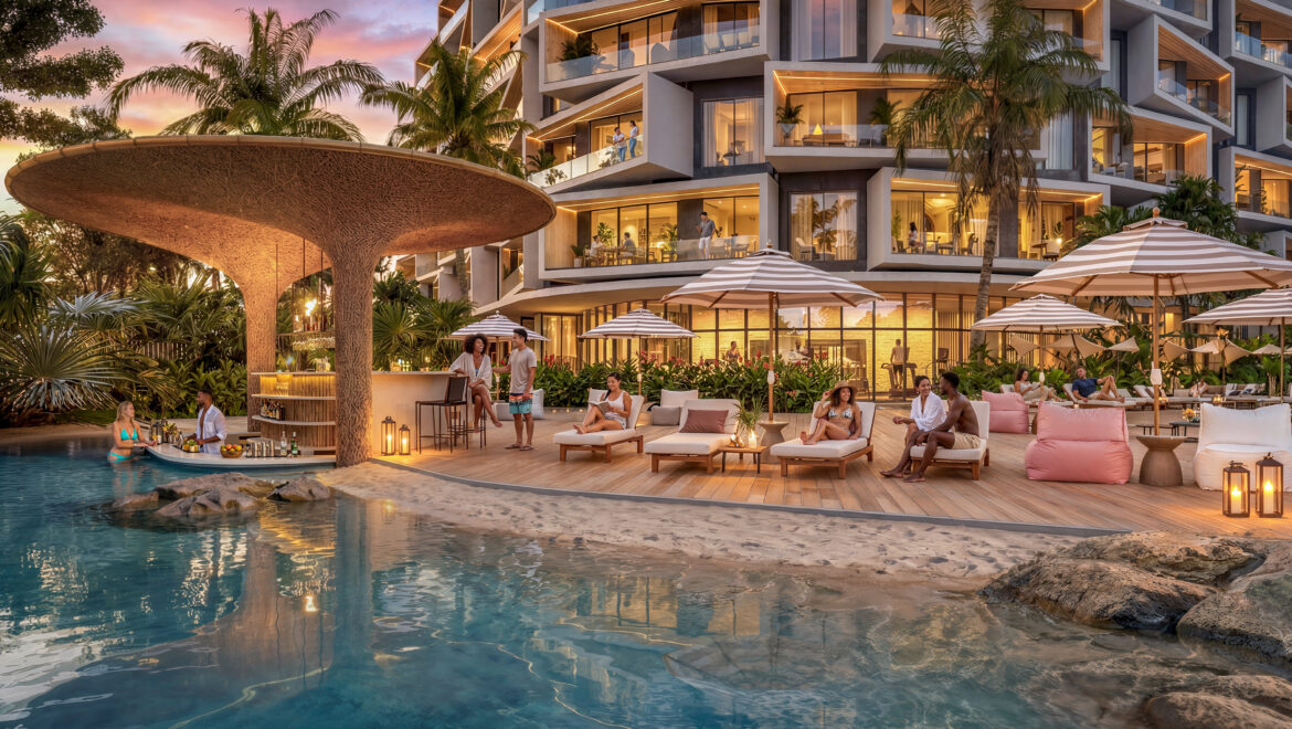 Resort pool area at sunset with lounge chairs, umbrellas, and guests relaxing by the water and bar.