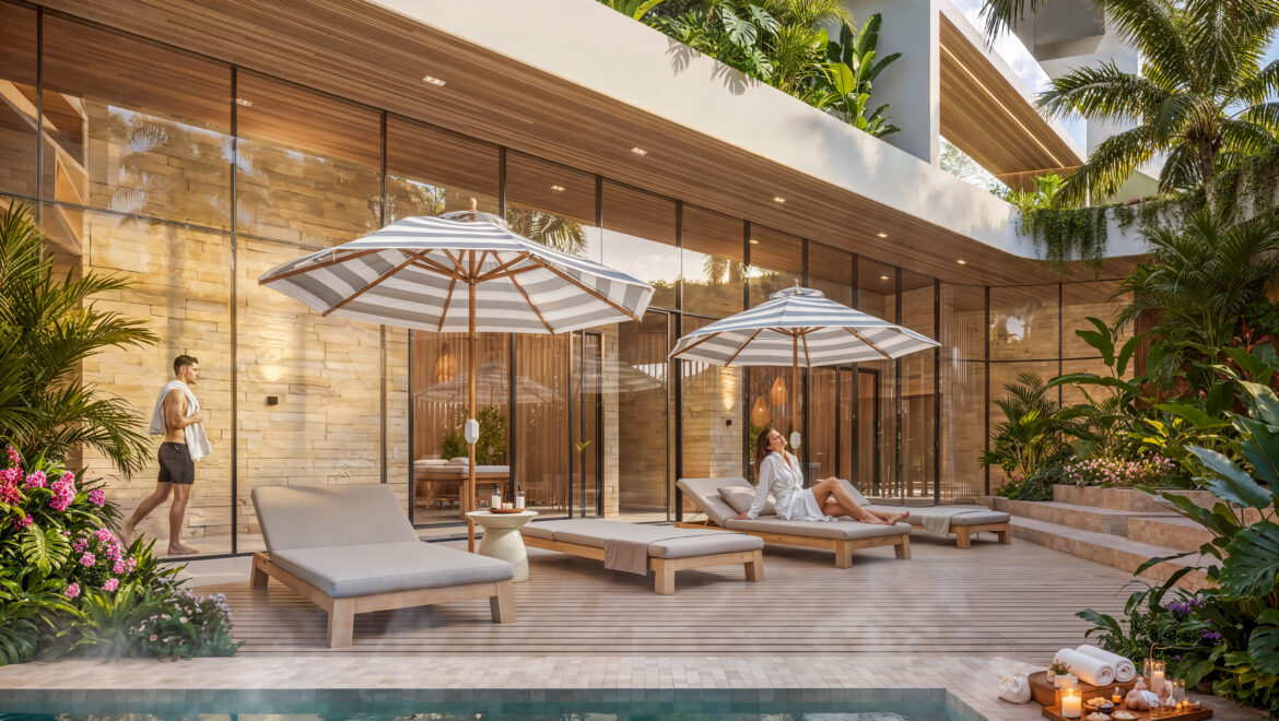 Modern villa courtyard with a turquoise pool, wooden deck loungers, striped umbrellas, and lush tropical plants nearby.
