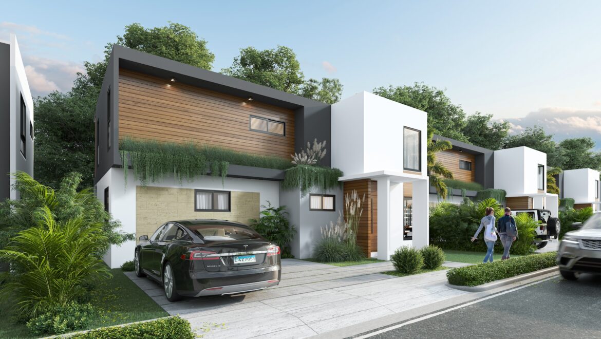 Modern townhouse row with white and wood-clad facades, lush landscaping, and parked cars on a sunny street.