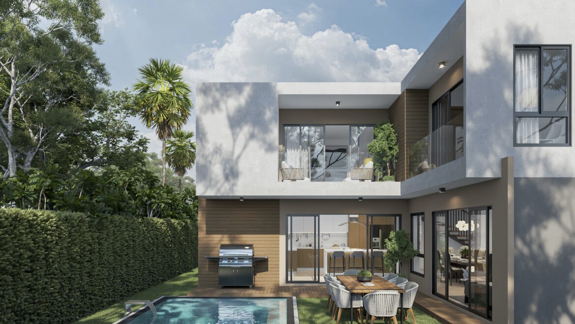 Modern two-story house with glass walls, balcony, and outdoor dining area beside a rectangular pool; lush landscaping nearby.
